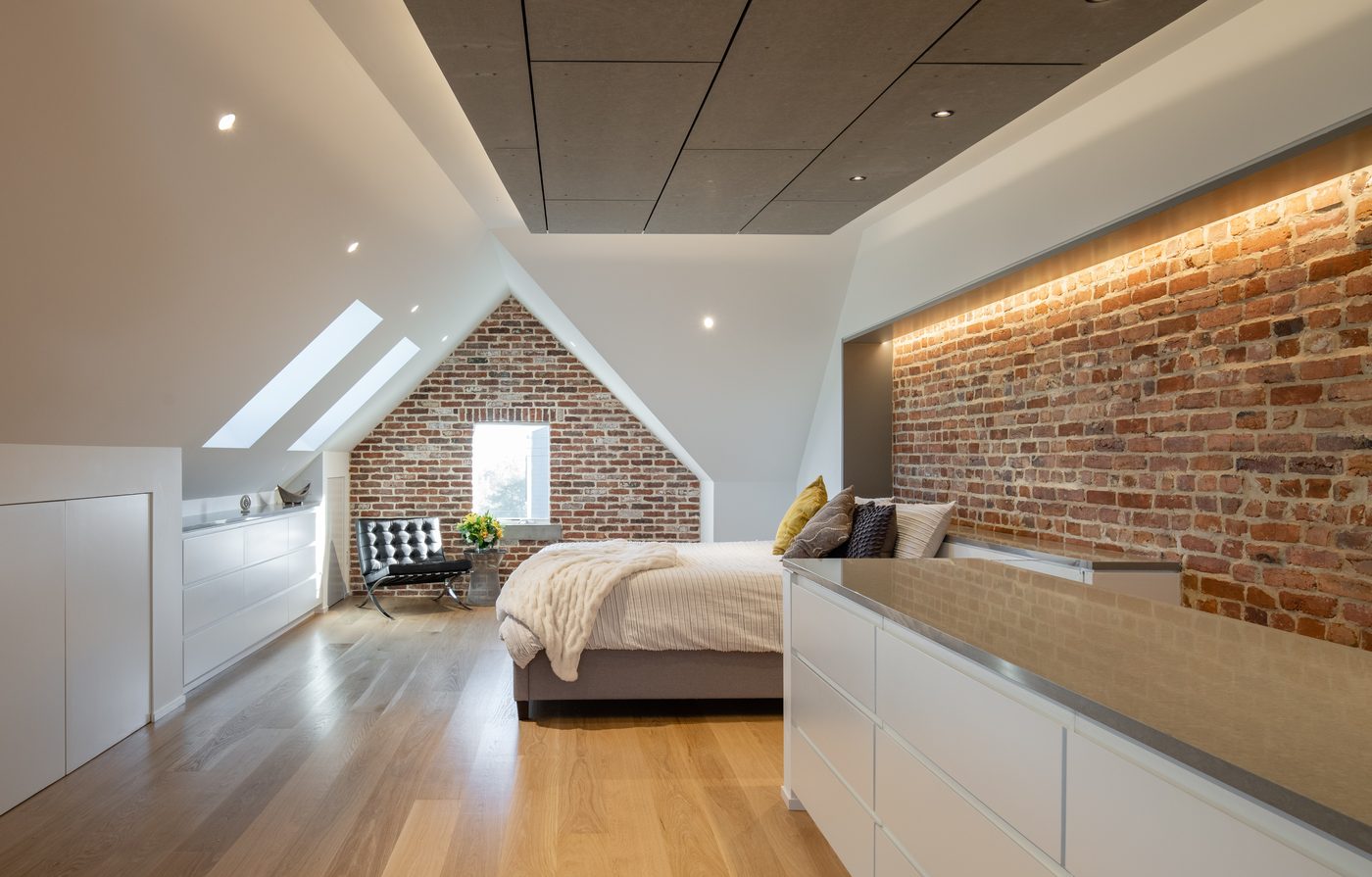 Finished attic primary suite with brick gable
